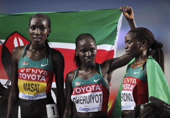 Vivian Cheruiyot of Kenya celebrates with her teammates after winning the women's 10,000 metres final at the IAAF World Championships in Daegu