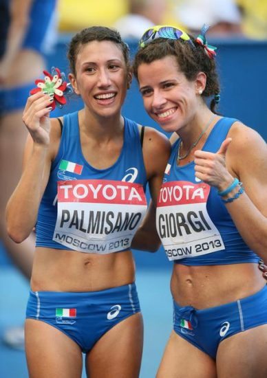 epa03822769 Italy's Antonella Palmisano (L) and Eleonora Giorgi (R) react after competing in the women's 20km Walk at the 14th IAAF World Championships at Luzhniki stadium in Moscow, Russia, 13 August 2013.  EPA/SERGEI ILNITSKY