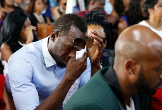 Jamaicas-Olympic-champion-Usain-Bolt-reacts-during-a-funeral-service-for-high-jump-star-Germaine-Ma