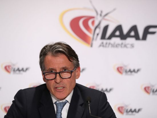 Sebastian Coe in front of IAAF logo