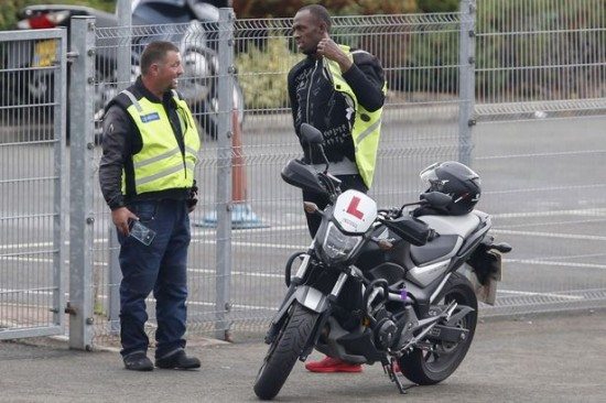 PAY-Usain-Bolt-learning-to-drive-a-motorcycle-in-London