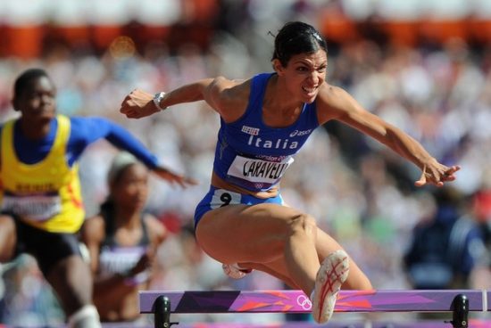LONDON, ENGLAND - AUGUST 06: Marzia Caravelli of Italy competes in the Women's 100m Hurdles heat on Day 10 of the London 2012 Olympic Games at the Olympic Stadium on August 6, 2012 in London, England. (Photo by Michael Regan/Getty Images)