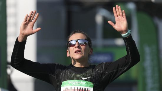 France's Clemence Calvin reacts after finishing, beating the previous French record, during the 43rd edition of the Paris Marathon on April 14, 2019 in Paris. - Calvin finished fourth in 2:23:41, bettering by 41 seconds the previous national record set in 2010. (Photo by KENZO TRIBOUILLARD / AFP)