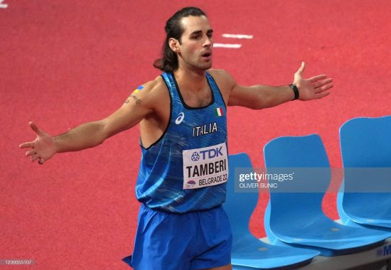 Italy's Gianmarco Tamberi reacts as he competes in the men's high jump final on the third day of The World Athletics Indoor Championships 2022 at the Stark Arena, in Belgrade, on March 20, 2022. (Photo by OLIVER BUNIC / AFP) (Photo by OLIVER BUNIC/AFP via Getty Images)
