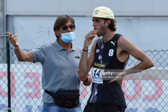PADOVA, ITALY - AUGUST 29: (L - R) Marco Tamberi coach and father, speaks with Gianmarco Tamberi during men's high jump final during the Italian National Athletics Championships at Daciano Colbachini Stadium on August 29, 2020 in Padova, Italy. (Photo by Pier Marco Tacca/Getty Images)