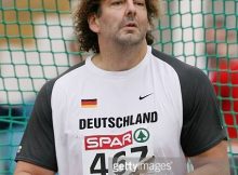 GOTHENBURG, SWEDEN - AUGUST 10:  Michael Mollenbeck of Germany prepares prior to the Men's Discus throw Qualifying Round on day four of the 19th European Athletics Championships at the Ullevi Stadium on August 10, 2006 in Gothenburg, Sweden.  (Photo by Alexander Hassenstein/Bongarts/Getty Images)